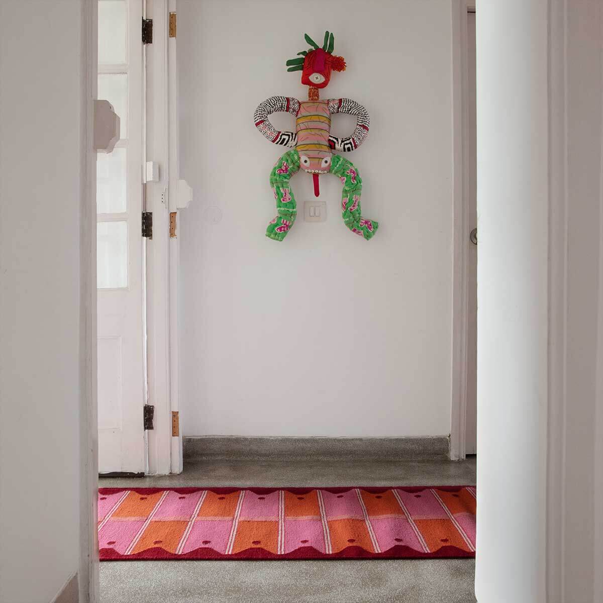 Hallway with Pink and Orange ladder runner rug