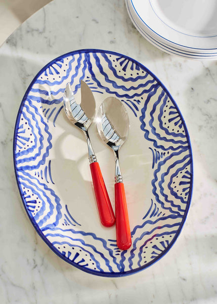 Salad Servers on Blue Platter