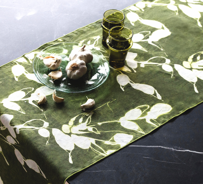 Porto Print Olive linen table runner styled as dining table centerpiece - Goldie Home