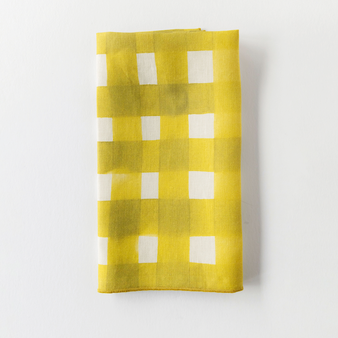 Yellow Cross-Hatch linen dinner napkin styled on place setting - Goldie Home