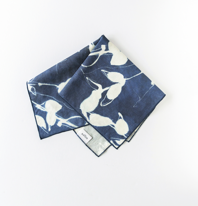 Porto Print Indigo linen dinner napkin styled on elegant place setting - Goldie Home