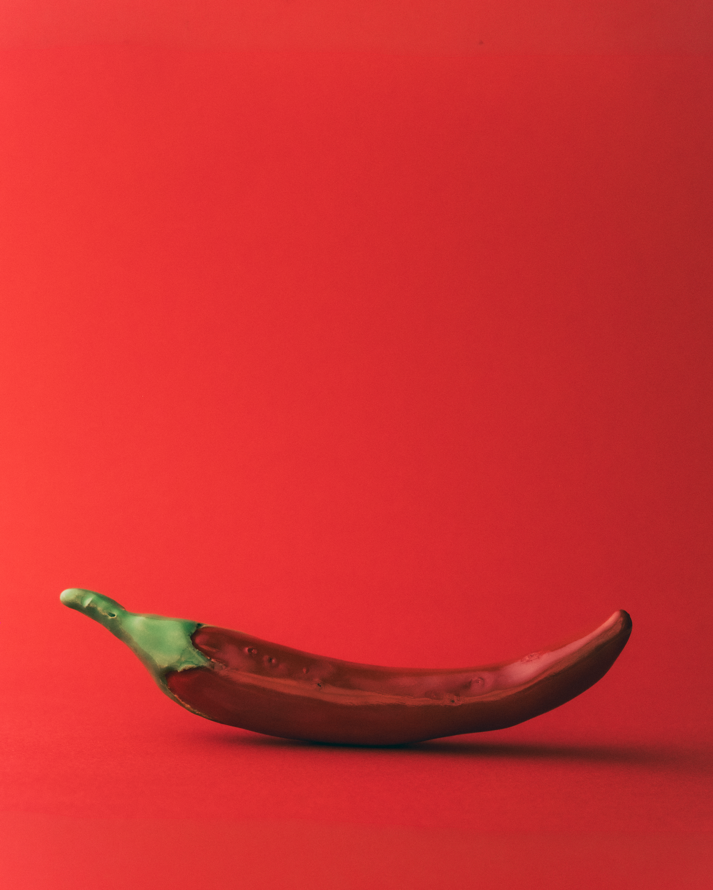 Marla Primrose Handmade Ceramic Glazed Chilli  – Red – side view