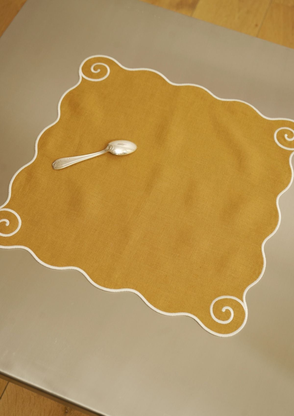 Volute Linen Napkin in Yellow ocher & White