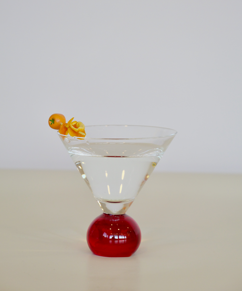 Set of two handcrafted cocktail glasses with red bobble stems, ideal for martinis and aperitifs – elegant barware from Marla Primrose.