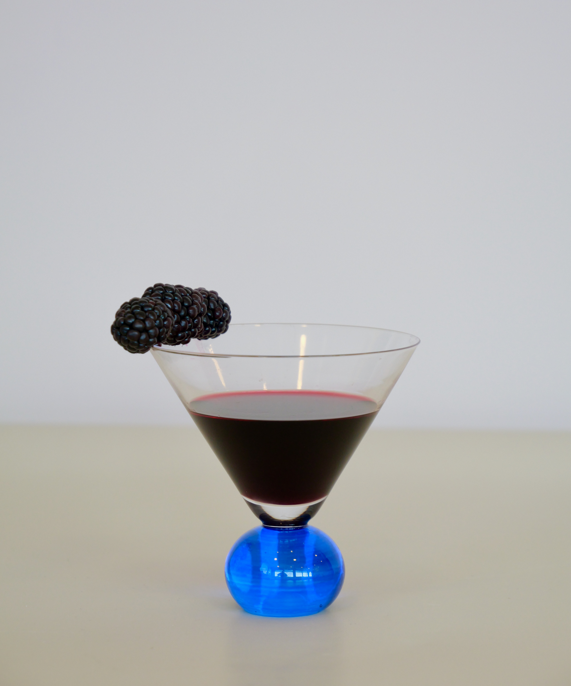 Set of two handcrafted cocktail glasses with blue bobble stems – elegant barware from Marla Primrose.