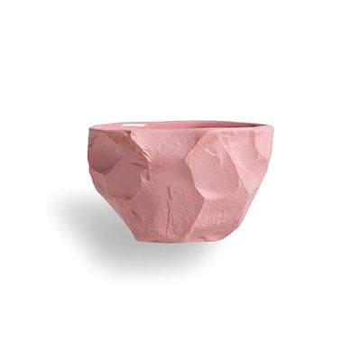 Chipped and carves, the Crockery collection is crafted with the tools of a stone mason and then hand poured with pink stained earthenware slip