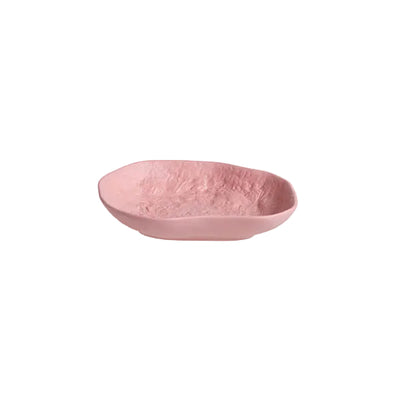 The small Crockery Pink platter is the perfect catch-all, created by 1882 Ltd. with Max Lamb, pink stained earthenware is poured into a mould crafted from hand chipped models