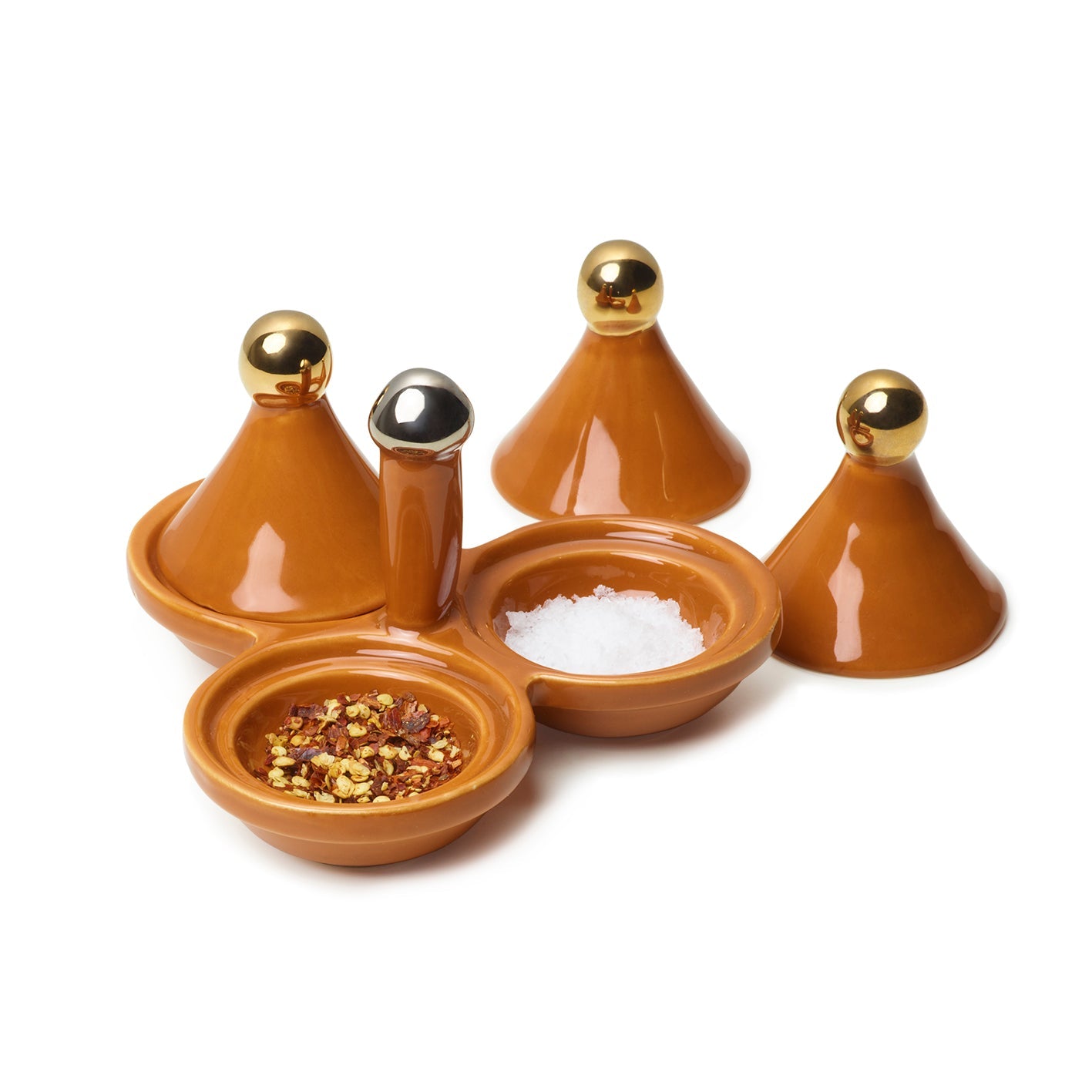 Set of ceramic containers with a central silver stem to hold and gold lids for each condiment dish on a white background.