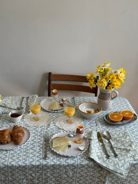 Tablescape using green wiggle pattern linen tablecloth Marla Primrose