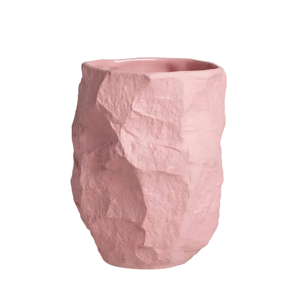 Tall Crockery Pink Vase by 1882 Ltd. with Max Lamb, chipped and crafted with the tools of a stone mason, this piece bounces the shadows off its uneven surface