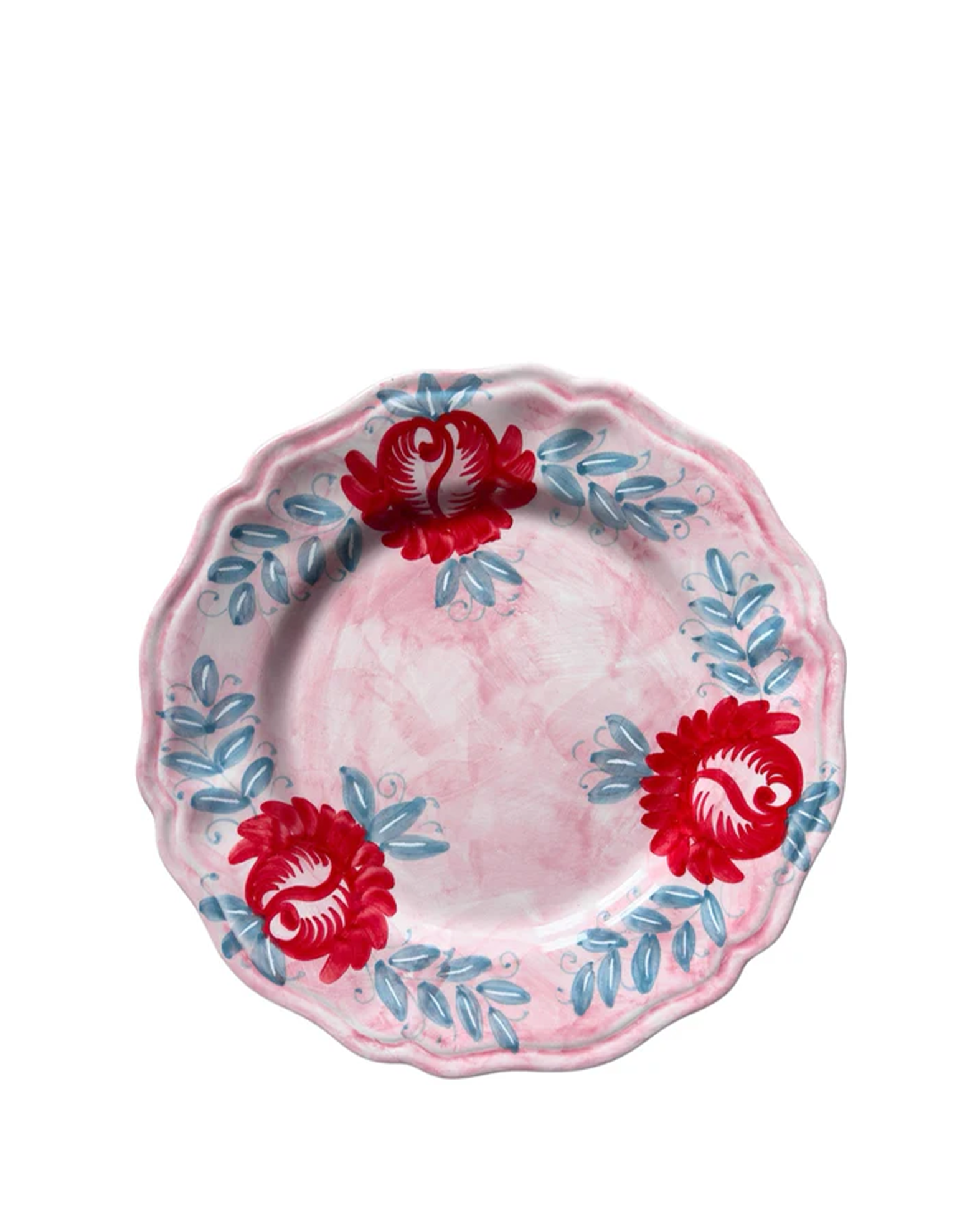 Decorative plate with red floral designs on a pink background