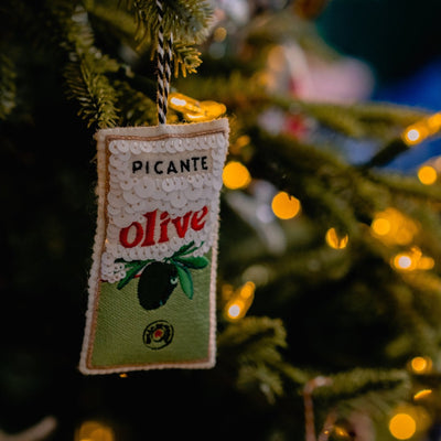 Sequinned and Embroidered Olive Tin Ornament on the tree