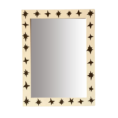 Mirror with star-shaped cutouts on a beige frame against a white background