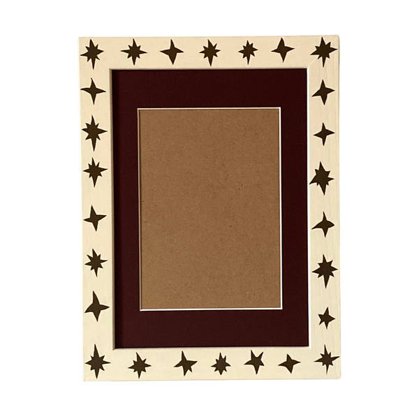 Decorative picture frame with star patterns on a white background