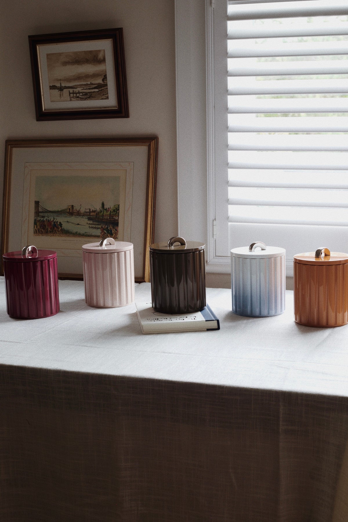 Row of five Vinidec Fluted Lacquer Ice Buckets in fall tones including terracotta, sage, and espresso