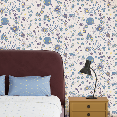 Bedroom with bold stars wallpaper, upholstered headboard, and nightstand. Wallpaper Solaris in white.