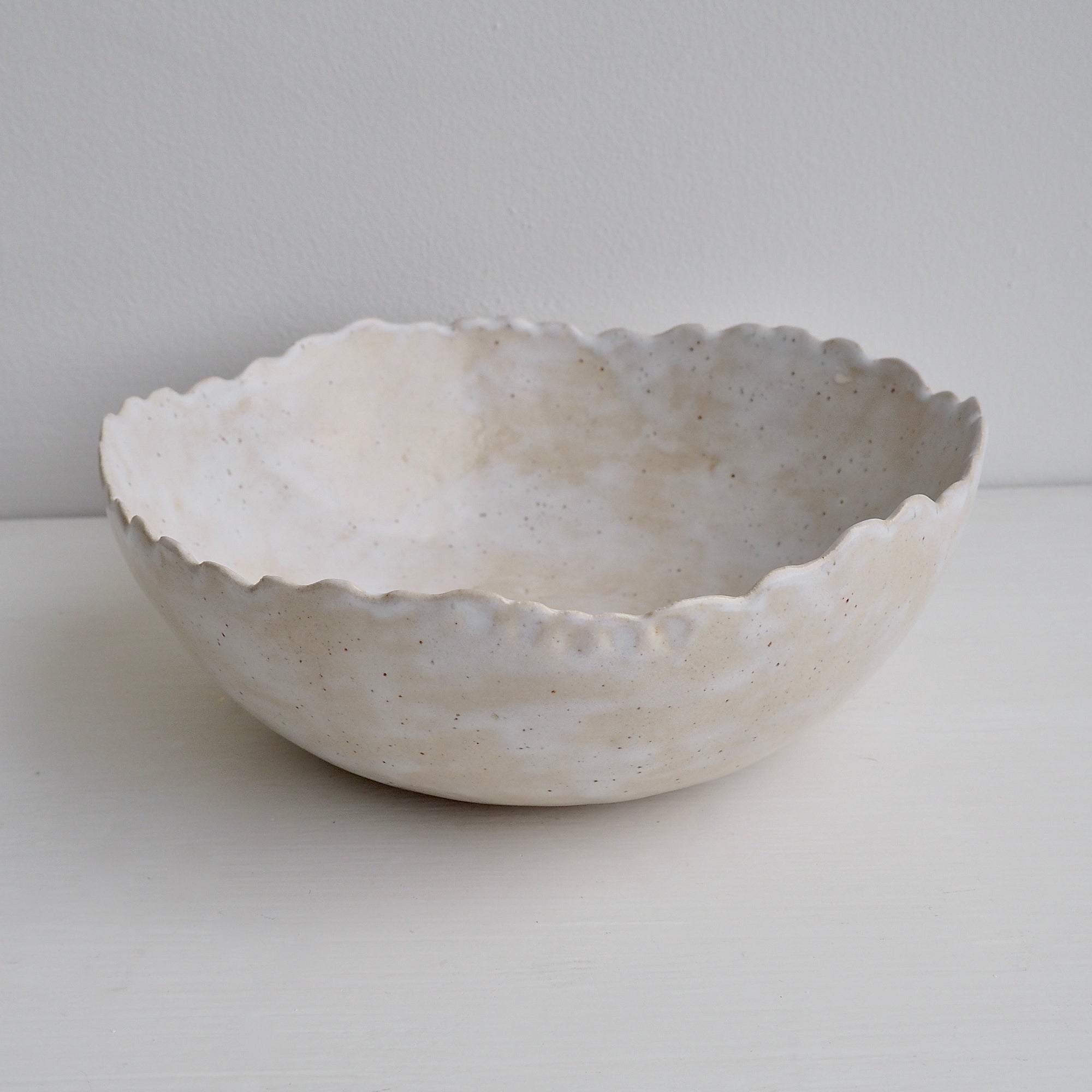 Handmade Cream/White Speckled Scalloped Ceramic Serving Bowl.