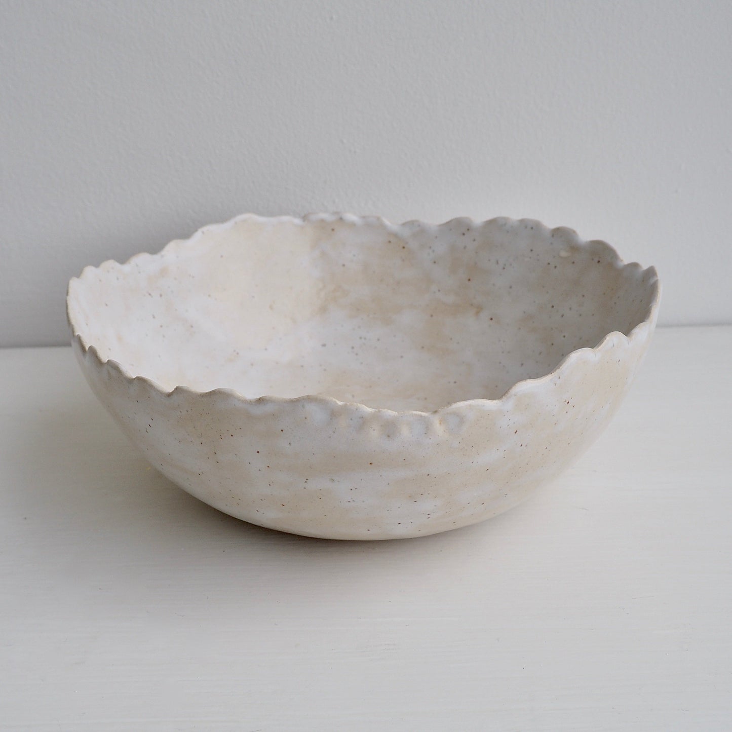 Handmade Cream/White Speckled Scalloped Ceramic Serving Bowl.