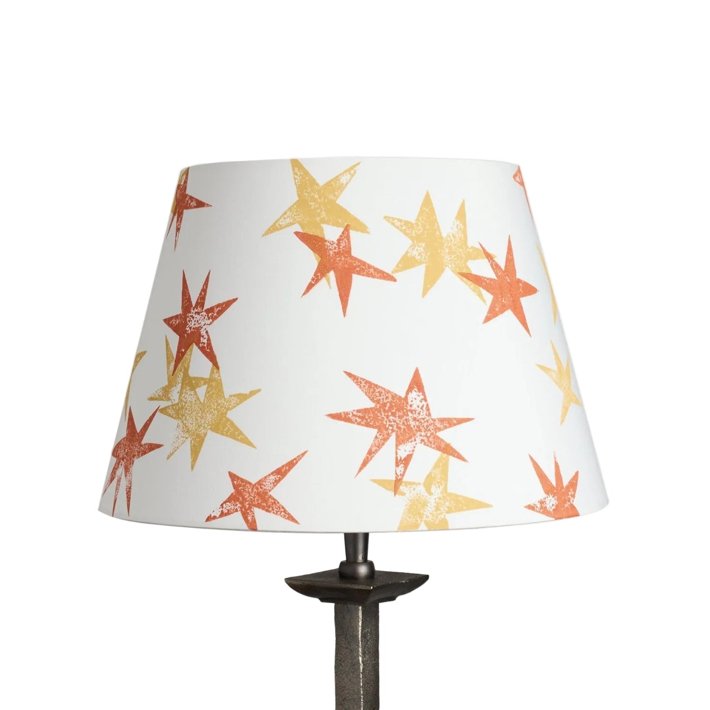 A stand-alone product shot of the Wonky Stars Lampshade in cream with scattered orange and yellow star prints. A bold lampshade and empire lampshade, perfect as empire shades for table lamps or kids lampshade styling.