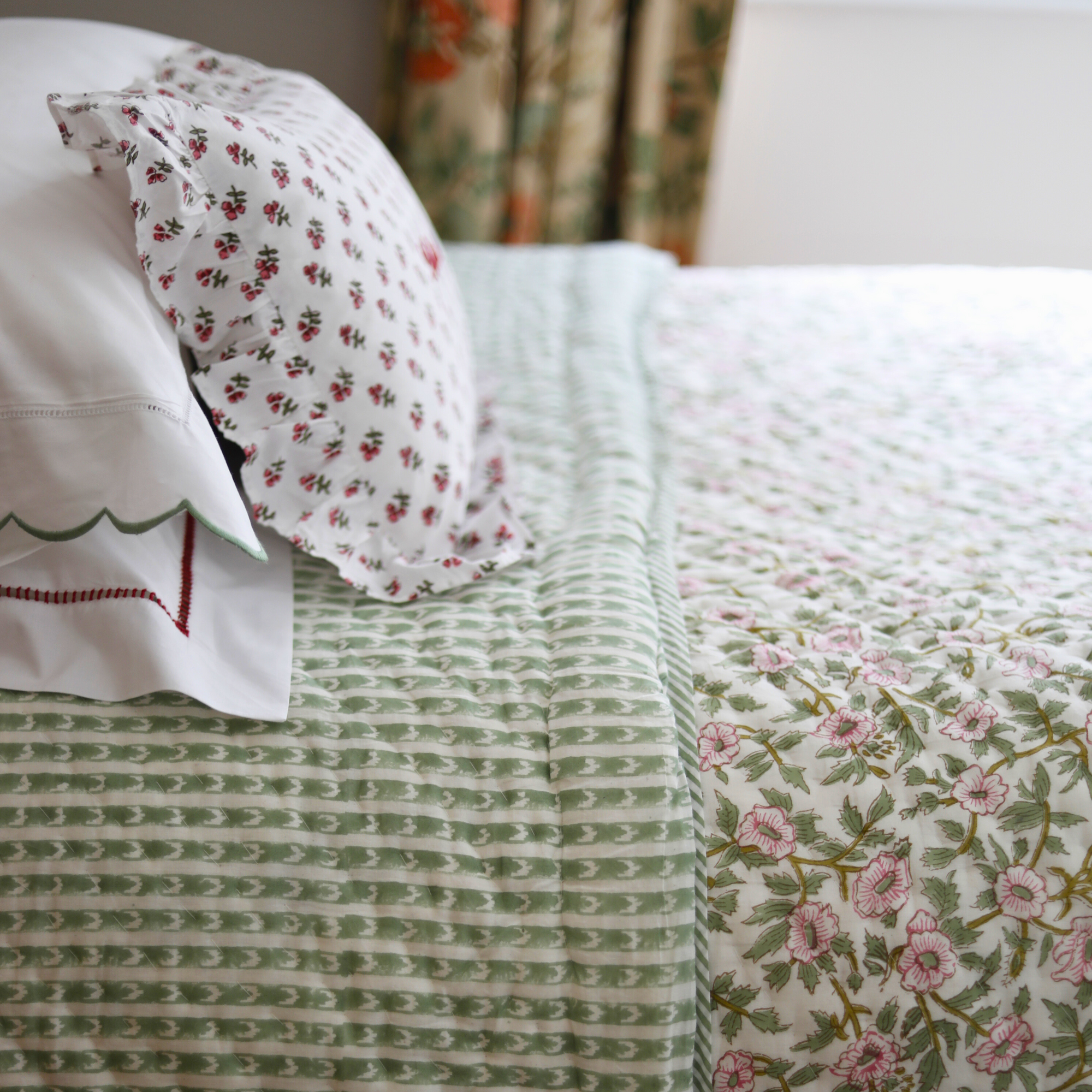 Green and pink floral quilt
