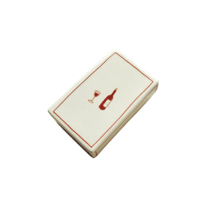 Hand-illustrated ceramic matchbox with wine bottle and glass illustration