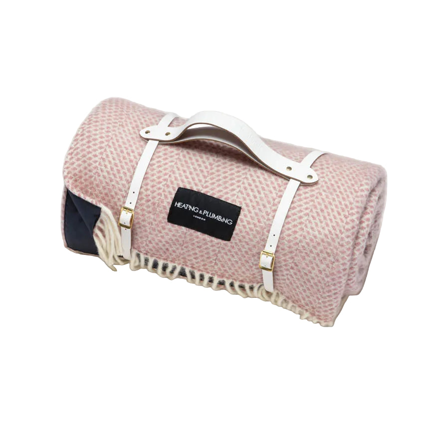 Dusky pink wool blanket combined with a stylish white leather strap and navy waterproof backing