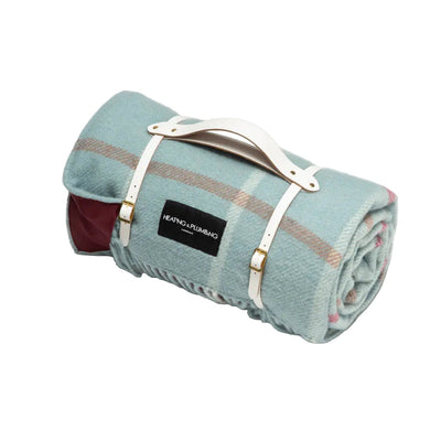 Duck egg check picnic throw blanket with wine colour waterproof backing and white leather strap. 