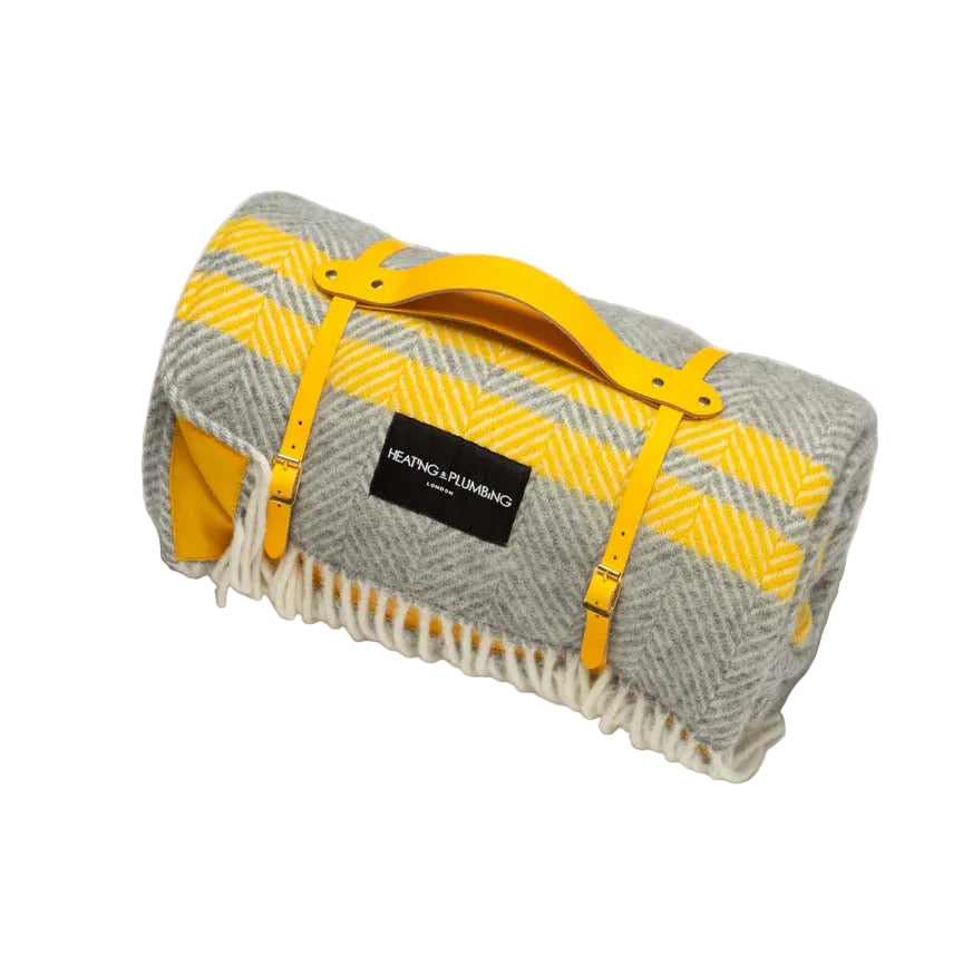 Gray and yellow picnic plaid blanket with a bright sunny yellow leather strap and a yellow waterproof backing