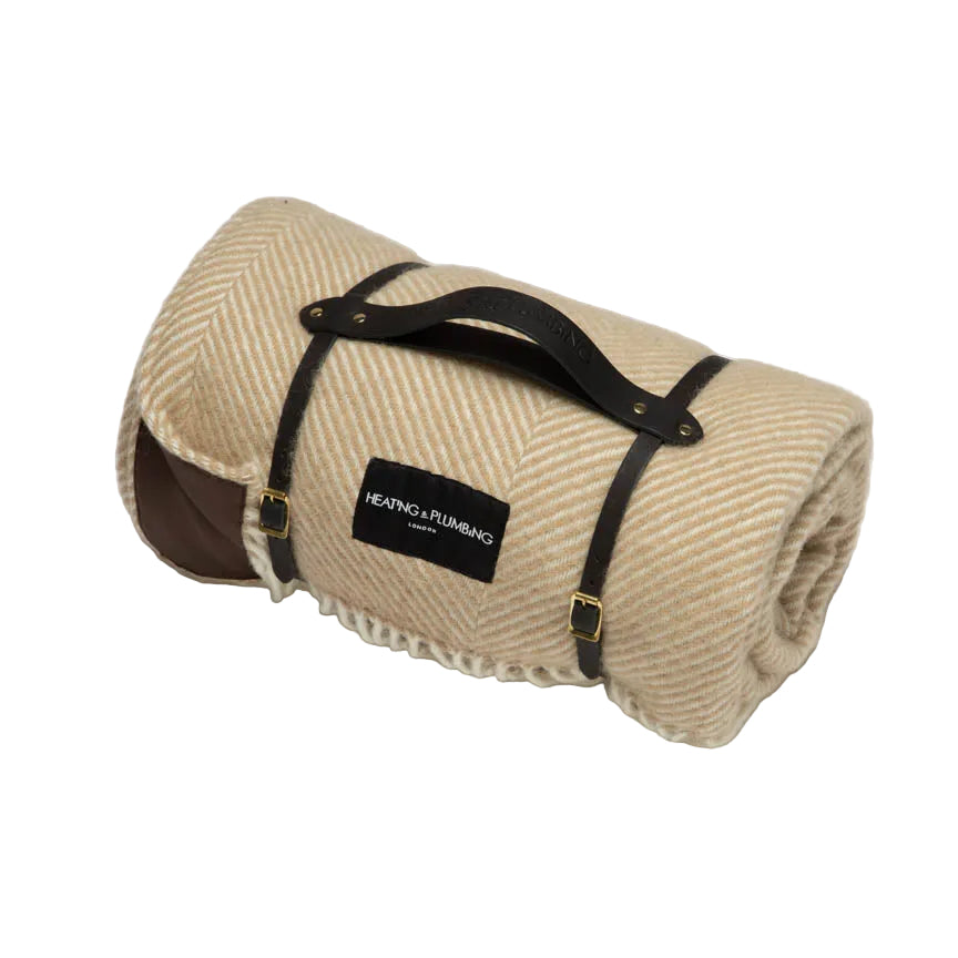 Beige light brown wool picnic blanket with black leather strap