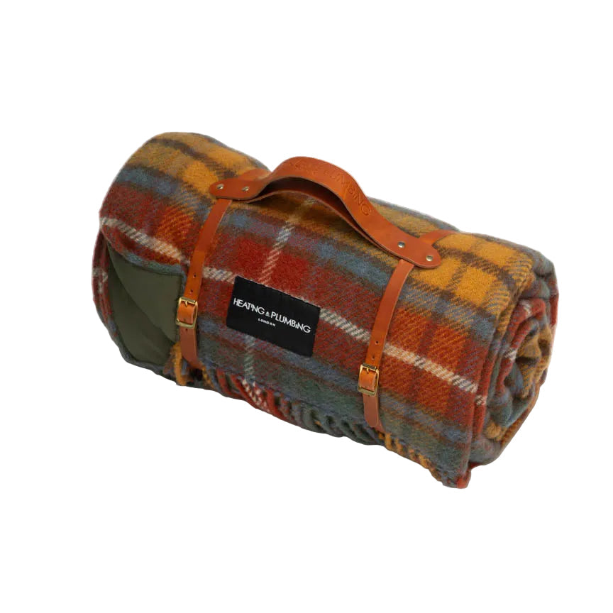 Classic tartan picnic blanket in pure new wool with a tan leather strap