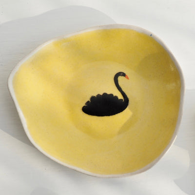 Yellow ceramic side plate with black swan