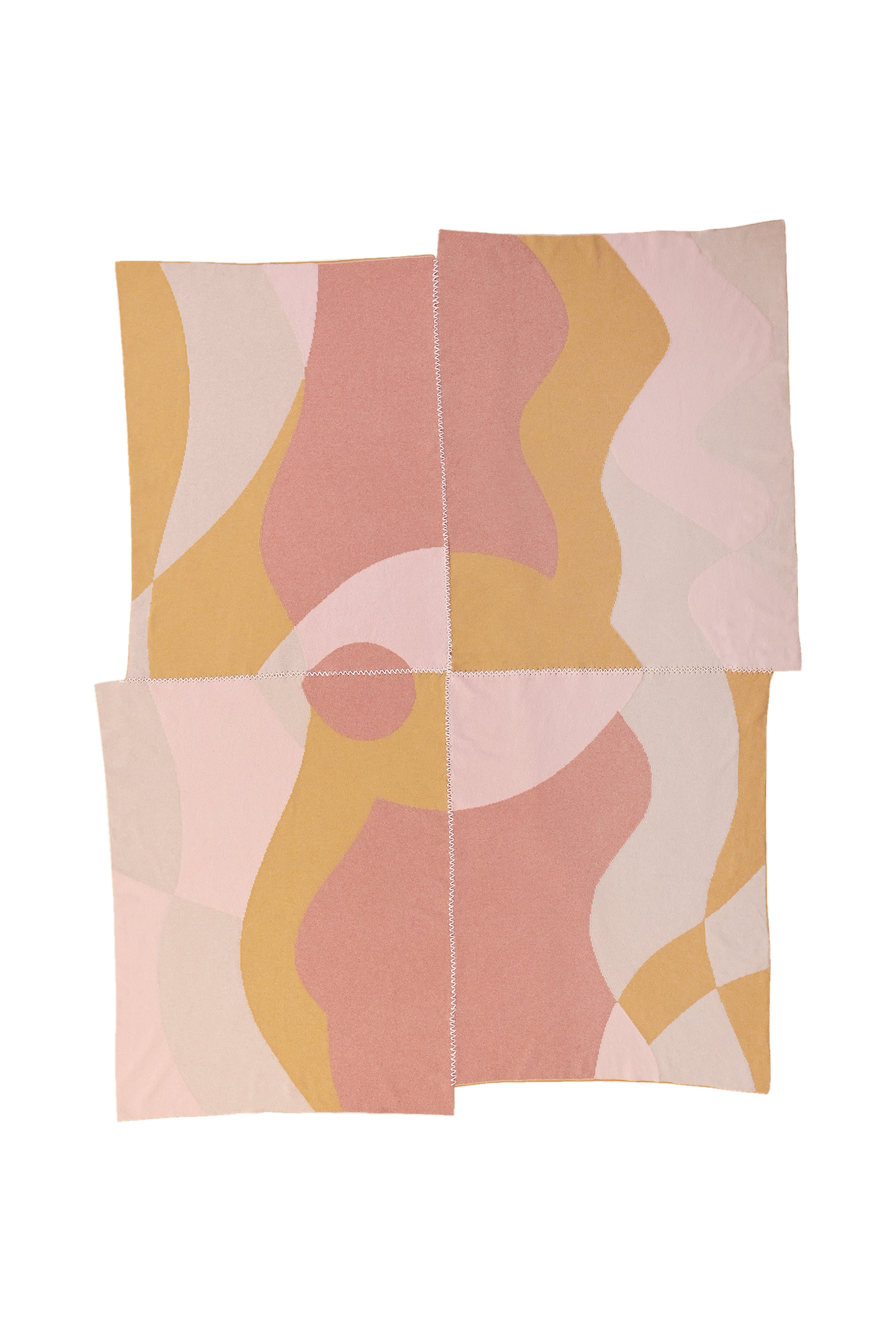front side of abstract knit blanket with hand-stitched seam in pink, yellow and beige wool