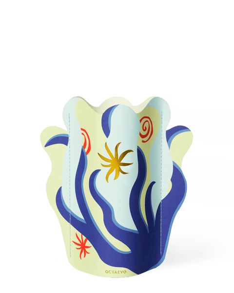 The OCTAEVO Amalfi Mini Paper Vase features abstract blue, yellow, and red shapes on a light background.
