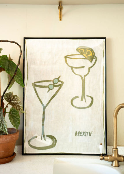 Apertif illustrated linen tea towel framed in a kitchen