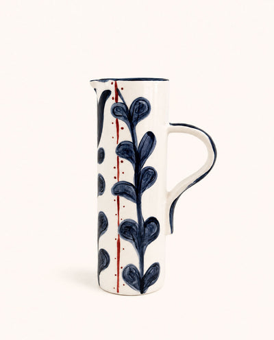 White handmade ceramic pitcher with blue botanical hand-painted design