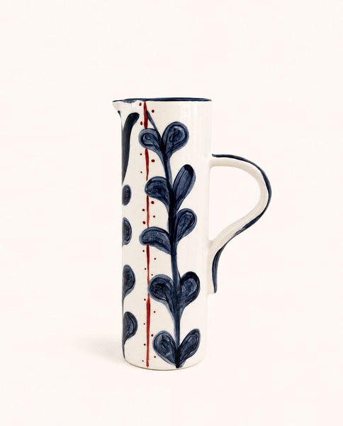 White handmade ceramic pitcher with blue botanical hand-painted design