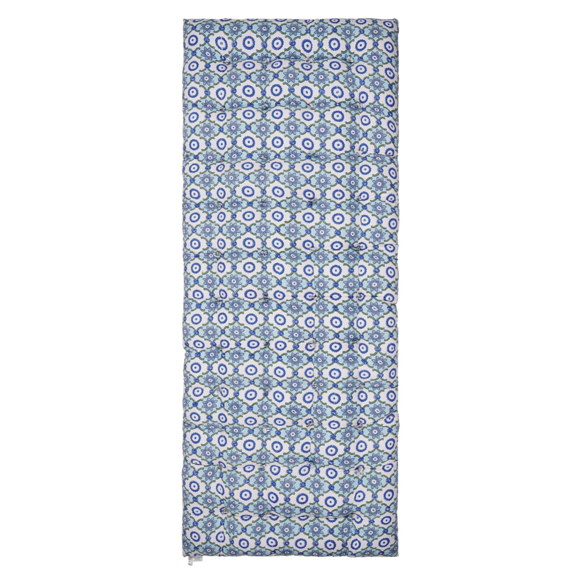 Patterned block printed mattress with blue and white geometric design on a white background