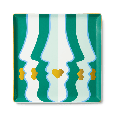 The Beso Ceramic Tray by Octaevo features abstract green, gold, and mint face profiles —ideal for a chic tablescape. 