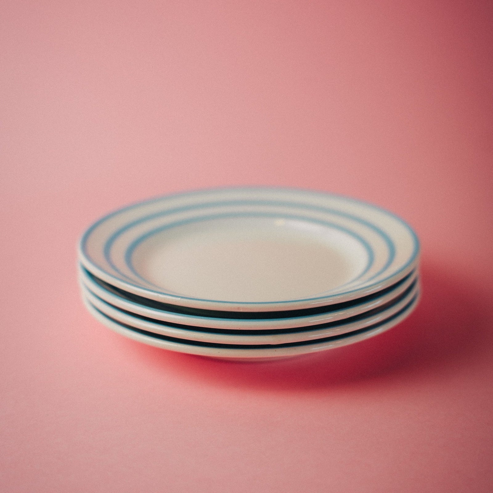 Four Blue Striped Plates