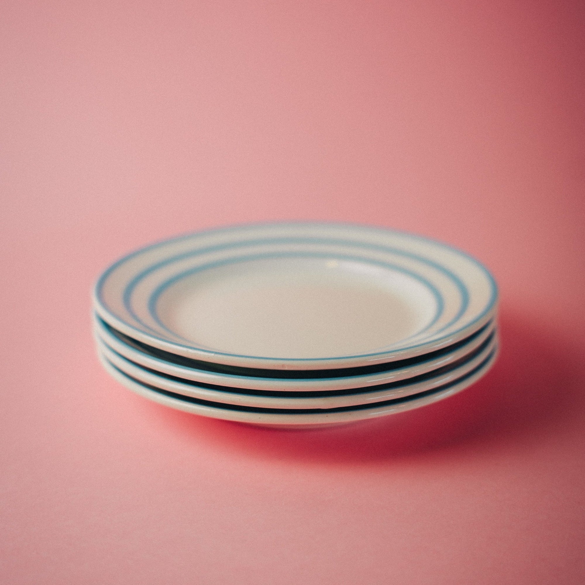 Four Blue Striped Plates
