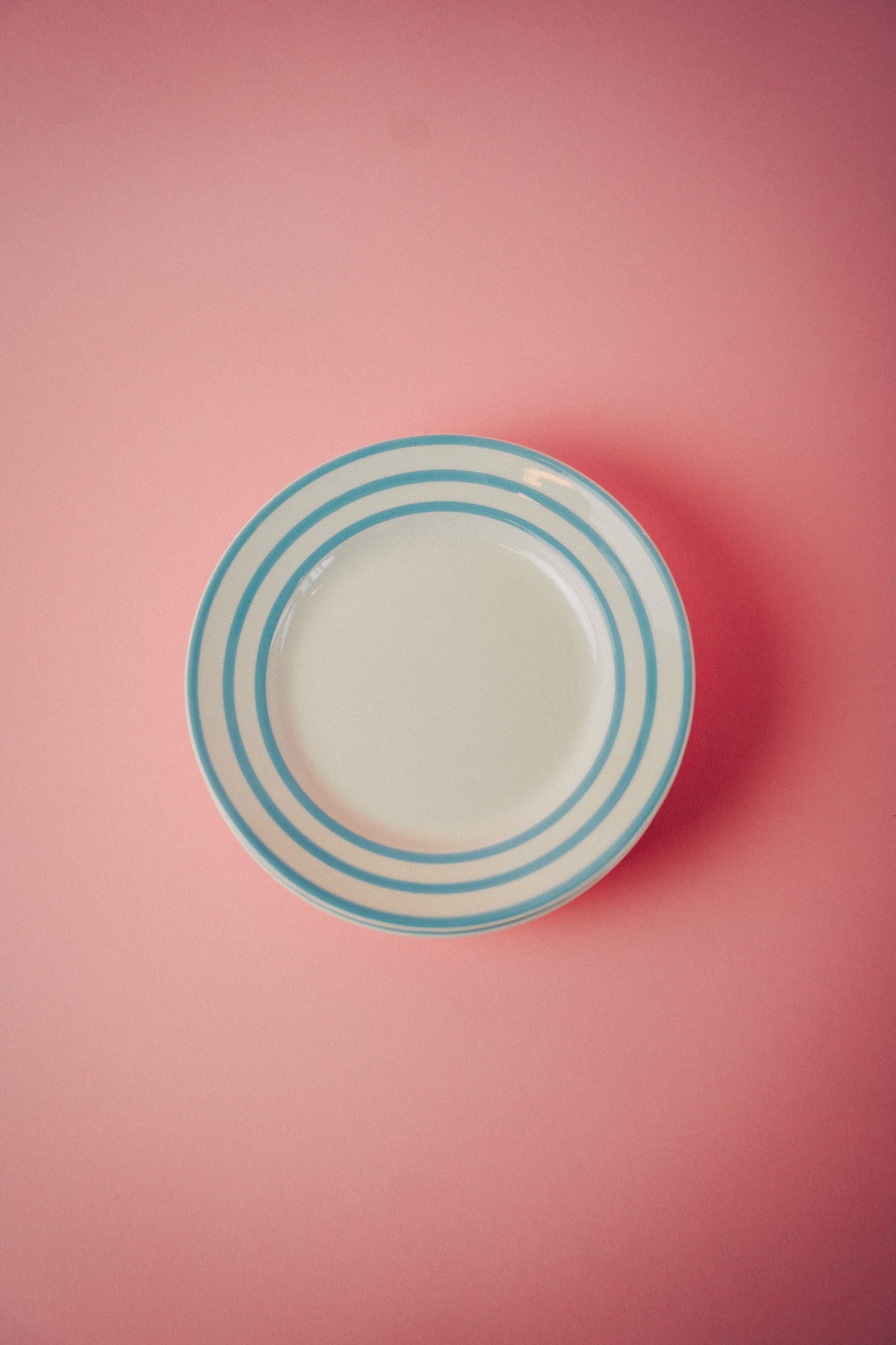 Four Blue Striped Plates