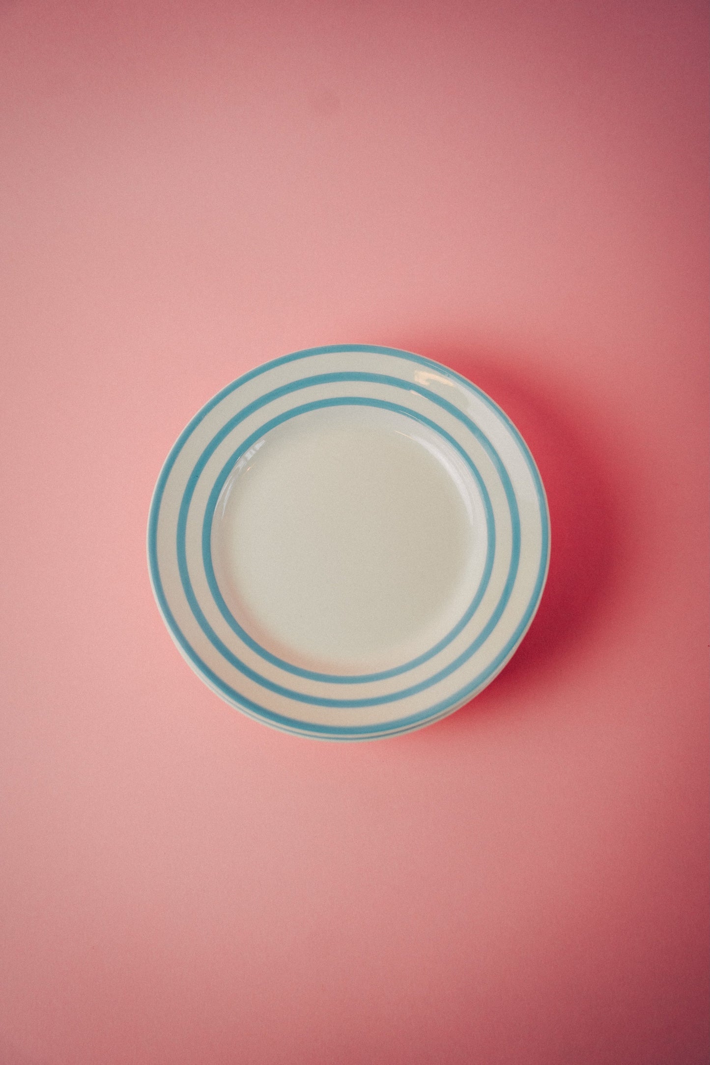 Four Blue Striped Plates