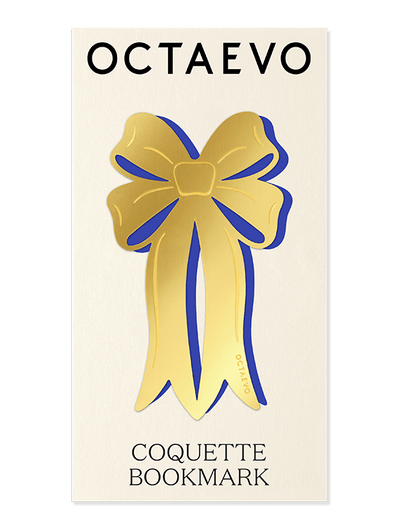 Elegant brass ribbon-shaped Bookmark Coquette by OCTAEVO with a blue outline on a cream brand card.