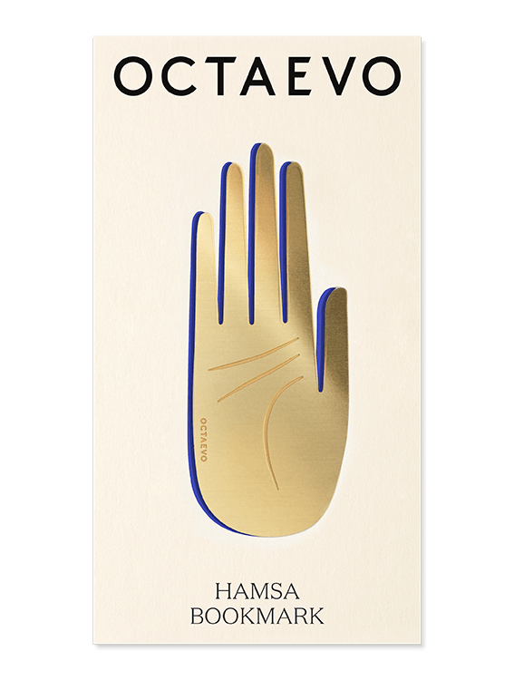 A gold Hamsa bookmark by OCTAEVO displayed on a cream card with the product and brand names.