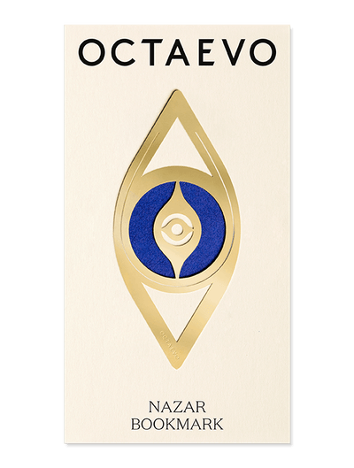 A gold brass Bookmark Nazar displayed on a branded OCTAEVO card.