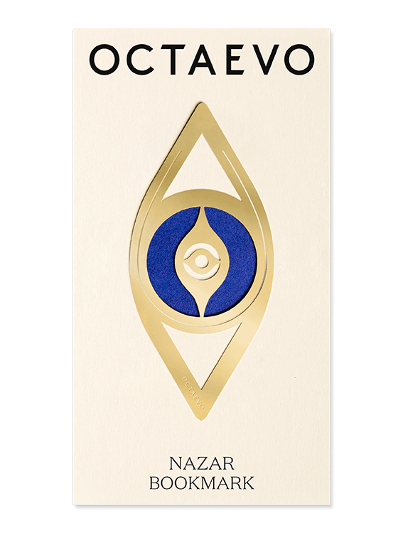 A gold brass Bookmark Nazar displayed on a branded OCTAEVO card.