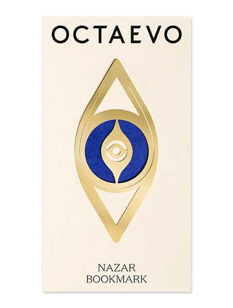 A gold brass Bookmark Nazar displayed on a branded OCTAEVO card.