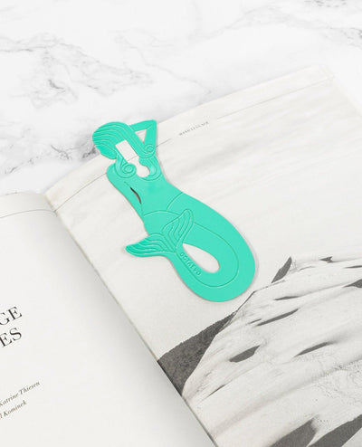 The Bookmark Sirena by OCTAEVO, in mint, clips onto the corner of your book for a stylish touch.