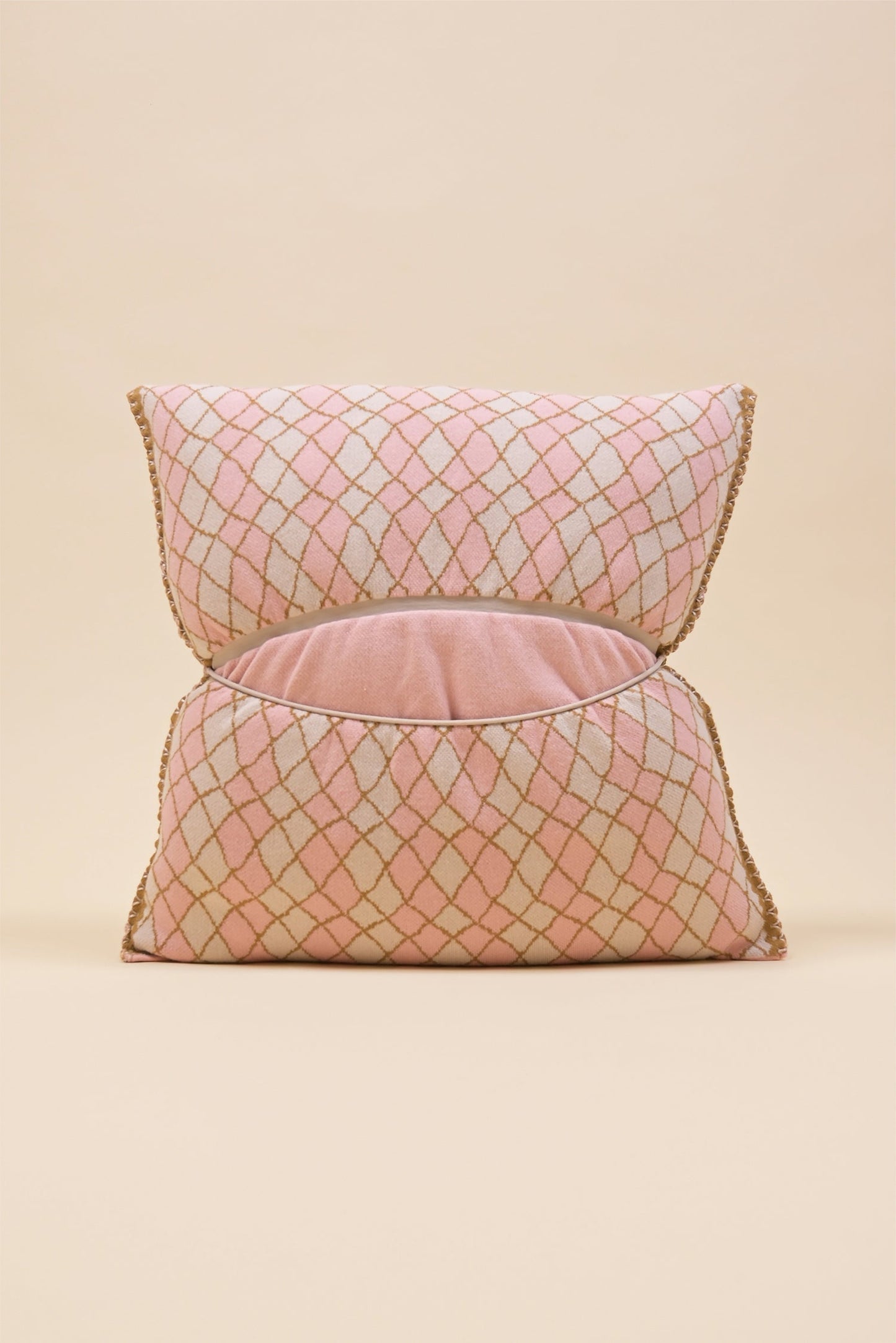 back side of pink bow-shaped knit pillowcase with romb pattern in viscose