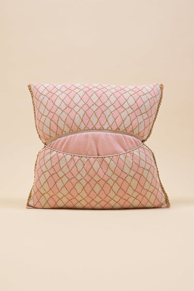back side of pink bow-shaped knit pillowcase with romb pattern in viscose